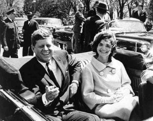 President-John-F-Kennedy and jackie bouvier kennedy onassis in the open car.jpg